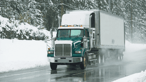 truck driving on icy road
